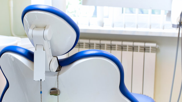 Closeup Image Of Empty Dentist Chair In Dental Clinic