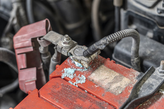 Corrosion build up on car battery terminals, Battery terminals corrode, visible in the form of white powder.Terminal corrosion can eventually lead to an open electrical connection.