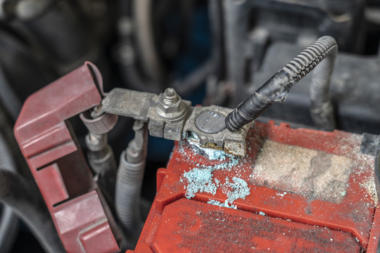 Corrosion build up on car battery terminals, Battery terminals corrode, visible in the form of white powder.Terminal corrosion can eventually lead to an open electrical connection.