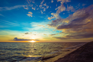 Fototapeta premium Sunset over sea with beautiful sky.