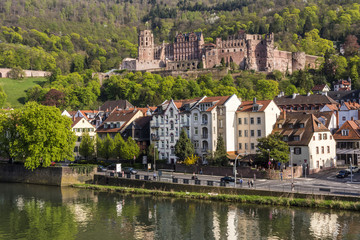 Fototapeta na wymiar Romantic Renaissance Heidelberg castle - landmark of the famous university city, view from the old bridge across Neckar river, Germany