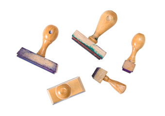 Several used stamps, stained in ink on a white background