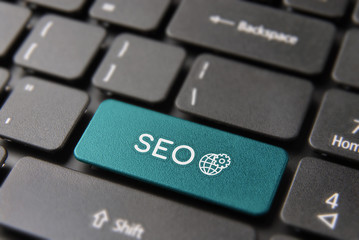 SEO business marketing concept on computer button