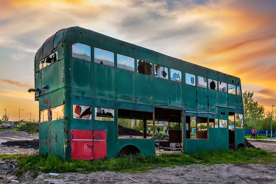 Novi Sad, Serbia April 13, 2018: Rusty Abandoned green Double-Decker Bus 