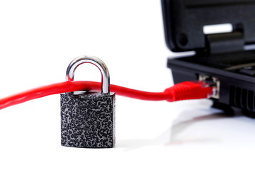 padlock locked on red network cable connected to laptop on white background, cyber security concept