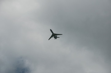 Fototapeta na wymiar a passenger plane flies against the backdrop of a stormy sky