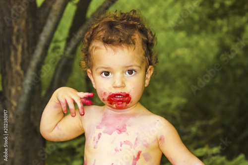 Kid Having Fun Eating Cute Little Boy With Curly Hair Having Fun
