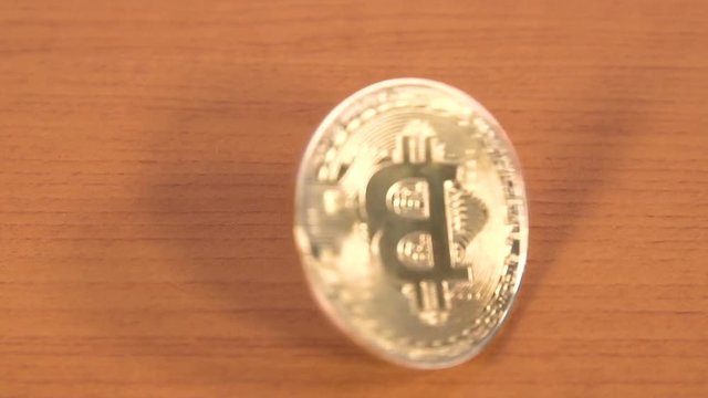 Bitcoin coin slow motion rotating.