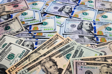 Dollars pile as background. A pile of US banknotes.