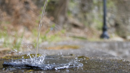 A stream of water hits the ground