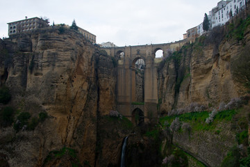 ancient bridge, connecting old and new part of andalusian town ronda over gorge el tajo of  Río Guadalevín