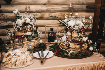 Wedding decor. Wedding interior. Festive decor. Table decor. Table with sweets and treats for guests. Candy bar Rustik. Selection focus