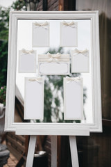 Wedding Photography: Classic Seating Chart  on a White Wooden Frame, copy space