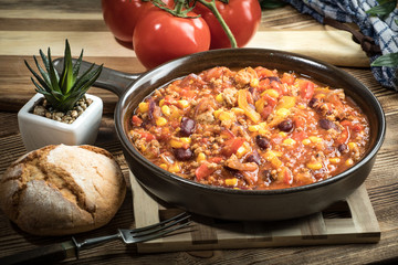 Chili con carne in a clay pan.