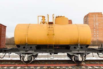 Fototapeta na wymiar Old railway car cistern of the era steam locomotives