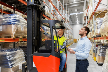logistic business, technology and people concept - loader on forklift and businessman with tablet...