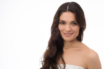 Fototapeta premium Smiling brunette beauty posing on camera. Having perfect skin. Mid age woman over 35 years old beauty concept.