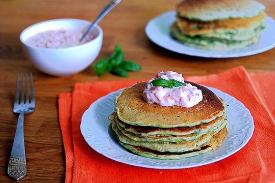Lush pancakes with spinach. Served with a sauce of Greek yogurt and baked sweet pepper