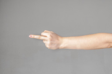 Woman hand showing middle finger on a white isolated background