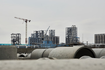 Obraz premium Concrete pipeline factory warehouse. Industry manufacturing concept