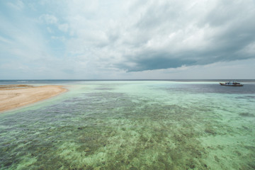 Fototapeta na wymiar Blue Sea Water at Tropical Beach