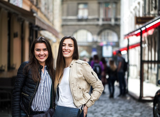 4231778 Two girls are walking around the old town and talking