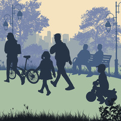 People in a city park silhouettes