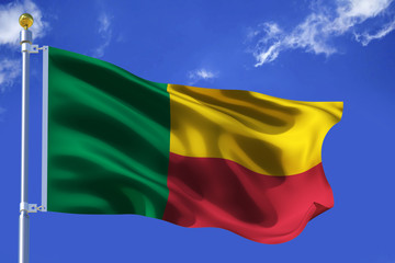 The silk waving flag of Benin with a flagpole on a blue sky background with clouds .3D illustration.