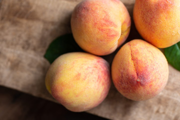Ripe peaches on wooden, tropical fruit, top view