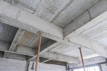 building under construction with iron steel support concrete beams