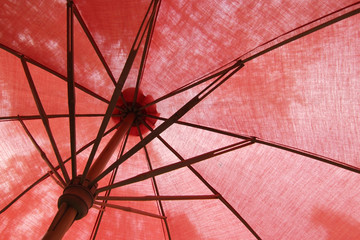 under the red beach umbrella