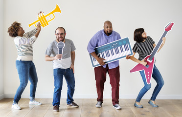 Group of diverse people enjoying music instruments