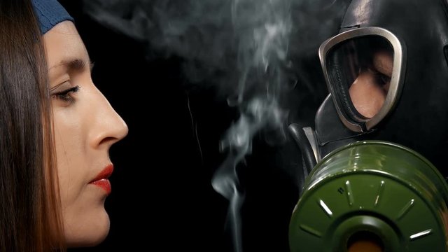 mask for cigarette smoke protection young man in gas mask to protect cigarette Smoking friend from harm,  close-up