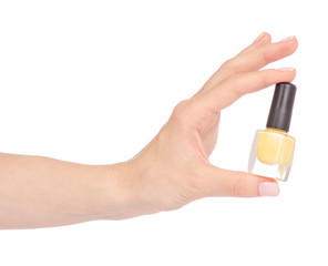 Yellow nail polish in hand