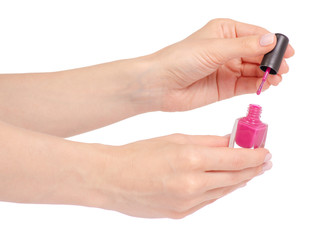 Pink nail polish in hand