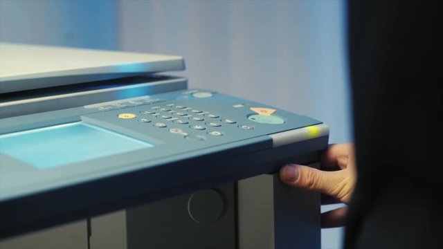Girl printing in the office
