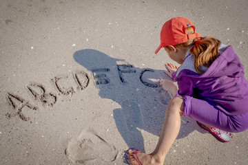 ABC written in the sand