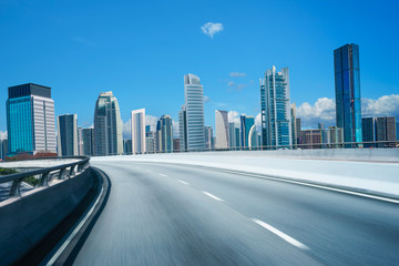 Highway overpass motion blur with city background .