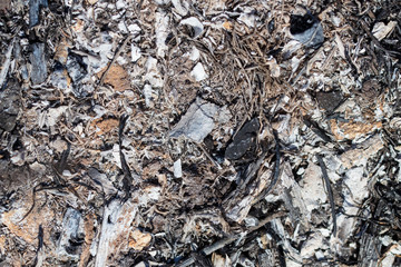 Black burned grass on the ground as an abstract background