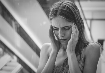 Depressed young woman, indoors