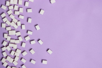  sugar cubes on a pastel background with space for text. top view, minimalism, design. diabetes, diet, sweets  