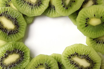  juicy kiwi slices on white background with place for text. vitamins, diet, proper nutrition 