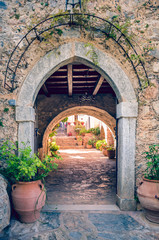 Fototapeta na wymiar stone arched gate. Gateway to orthodox monastery located in Crete