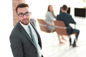 modern businessman standing in office.