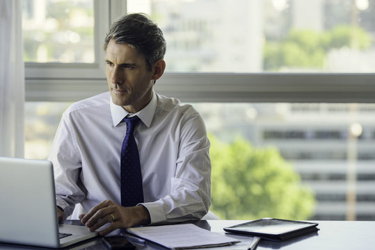 Man using laptop computer in office
