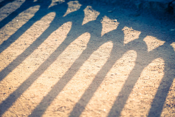 patterned shadow on the ground on a Sunny day