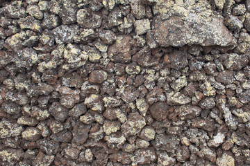 Hintergrund – mit Moos bewachsene Natursteinmauer