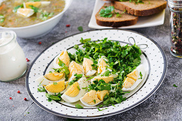Boiled eggs with greens. Healthy food. Summer salad
