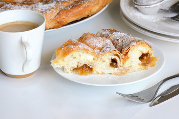 .Ensaimada with Cabell d' and cup of coffee.  This is traditional pastry  in Mallorca, Balearic, Islands  and  one of the most iconic pastries in Spain eating at breakfast, snack time and dessert..