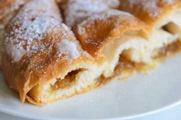 Piece of Ensaimada with Cabell d' angel,  is  coil-shaped flaky pastry  from Mallorca,  Balearic Islands. This is one of popular pastries in Spain eating at breakfast, snack time and dessert